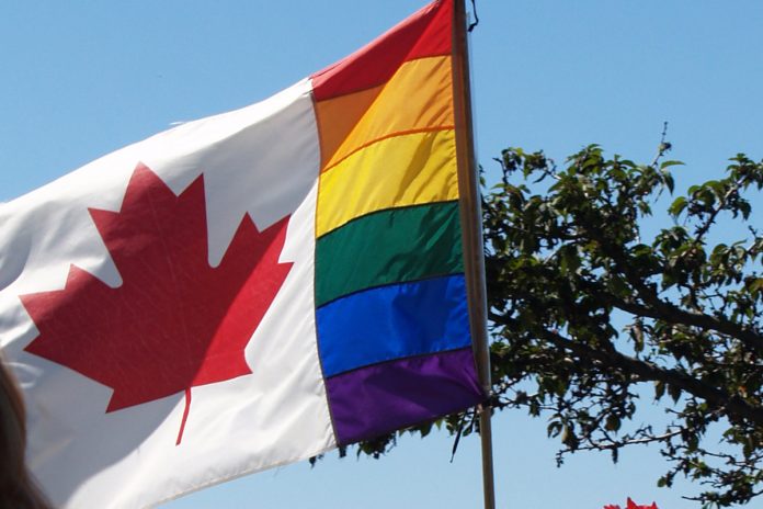 The symbol flag of LGBTQ community at Pride Parade, Vancouver, BC; Photo by ©the Pacific Post